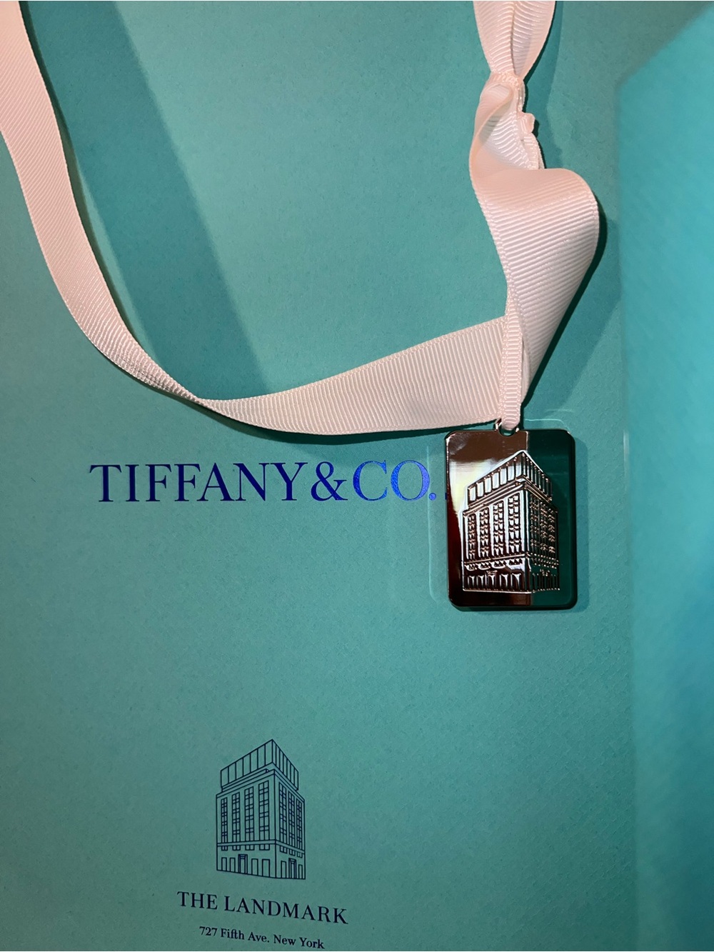 Tiffany & Co. Silver Landmark Charm, Medium Bag, and Medium Box
